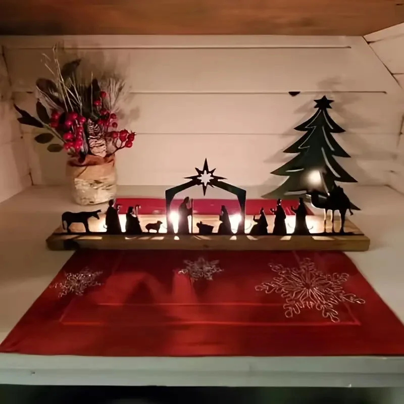 Crèche de Noël en métal dans un décor festif